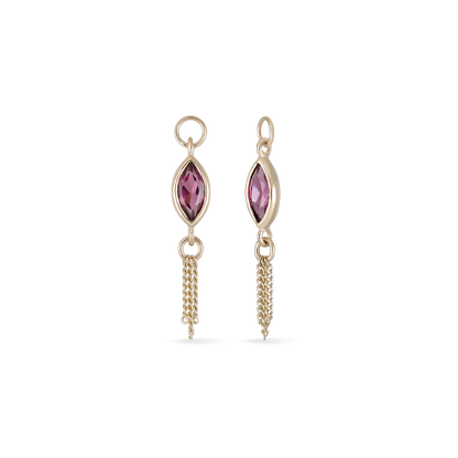 14K gold charm of a marquise-cut Rhodolite Garnet paired with three delicate gold curb chain tassels