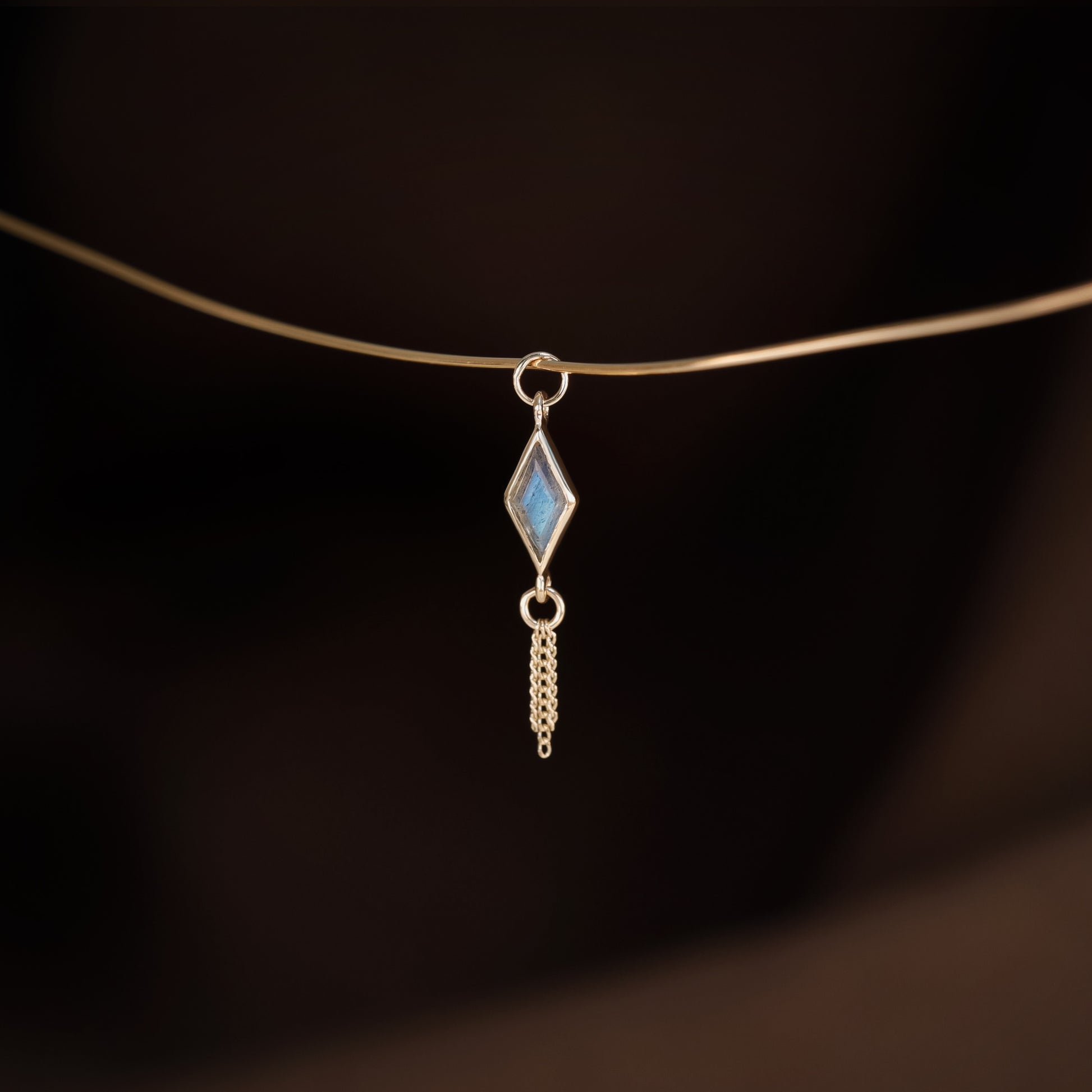 14K gold charm of a kite a Rhombus-cut Labradorite paired with three delicate gold curb chain tassels