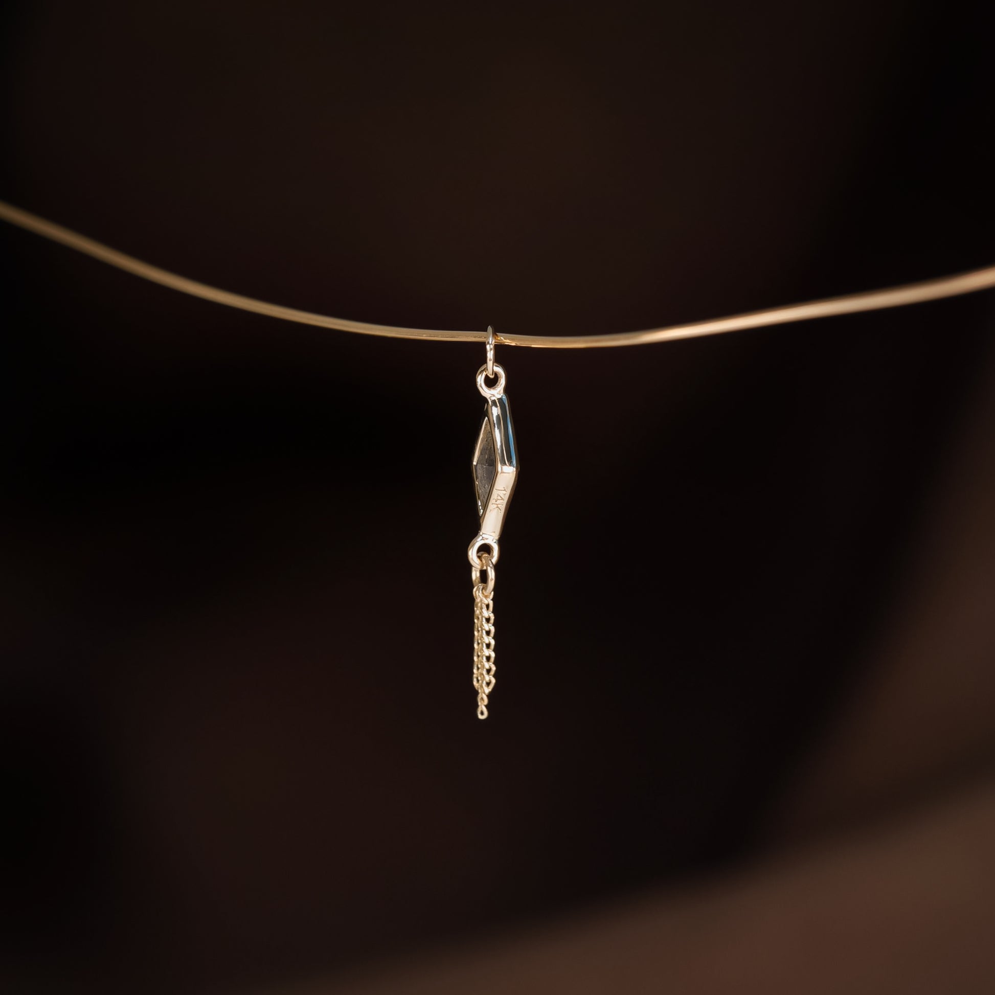 14K gold charm of a kite a Rhombus-cut Labradorite paired with three delicate gold curb chain tassels