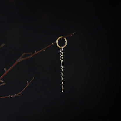 14K gold mixed-link drop chain charm hanging on a branch