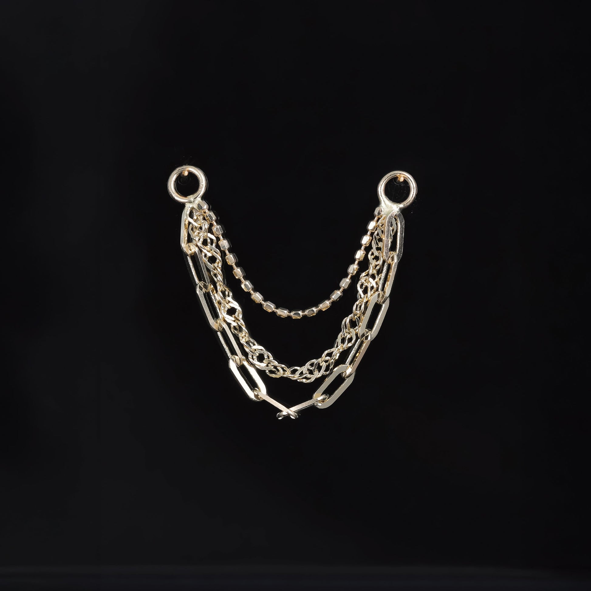 Front view of 14K yellow gold mixed chain attachment that comes with ball chain, Singapore chain and clip chain displayed on a black background