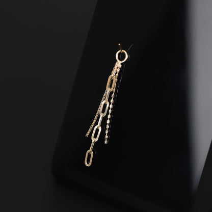 14K yellow gold mixed chain charm that comes with clip chain, box chain and ball chain displayed on black surface