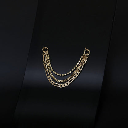 14K gold triple mixed chain attachment on a dark background